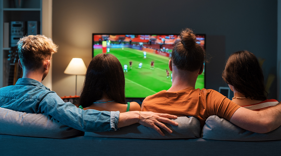Premium IPTV sports streaming - friends watching football live in 4K